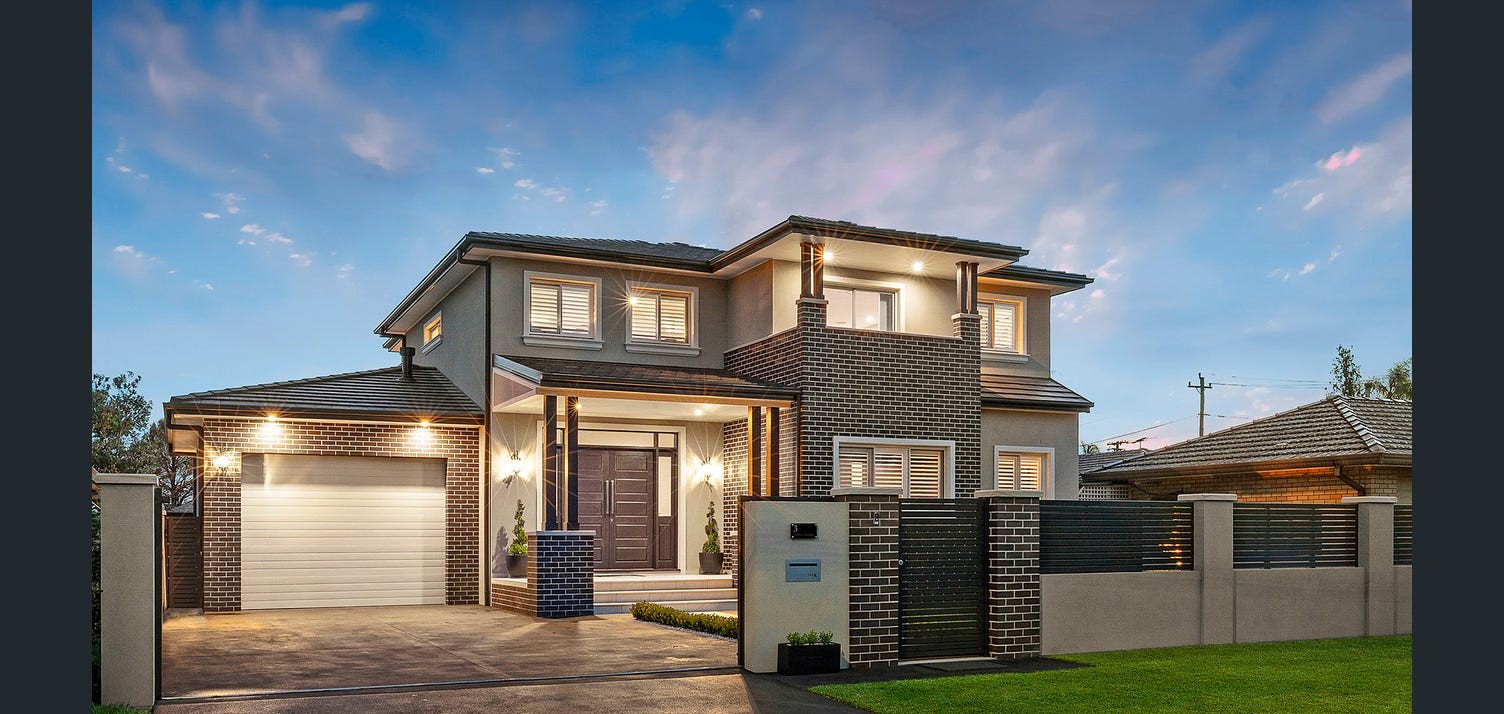 3 Selway Ave, Moorebank, contemporary two storey residence with brick and render facade at dusk by Micris Design.